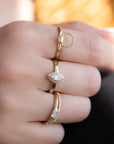 A delicate 14k yellow gold engagement ring, set with a 0.25 baguette cut white diamond.