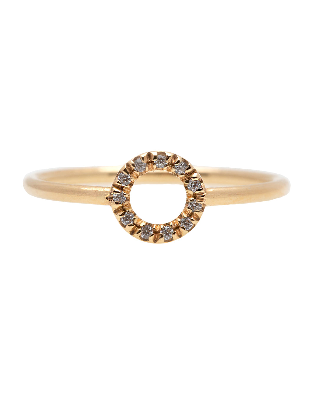 A dainty 14k yellow gold ring with a circle on top, set with brilliant cut white diamonds. 