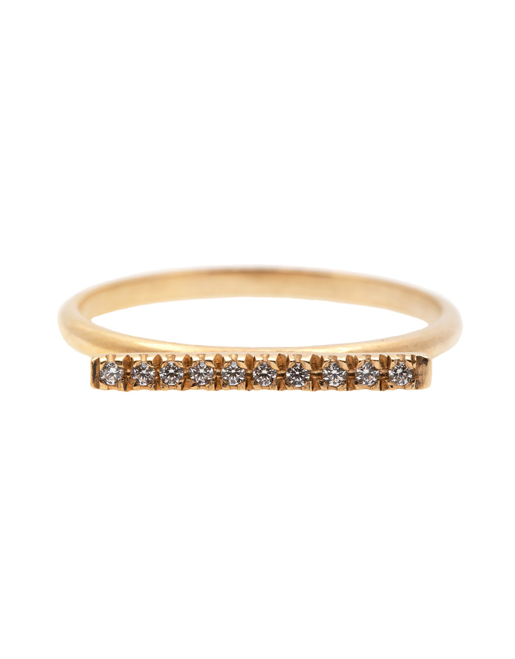 A dainty 14k yellow gold ring, with a horizontal bar on top, set with ten tiny white diamonds. 