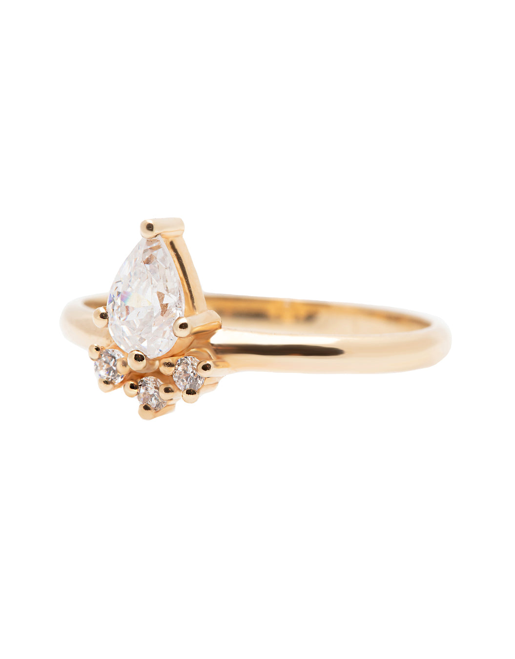 A 14k yellow gold engagement ring, set with a center pear cut white diamond and and halo of three small white diamonds. 