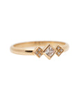 A delicate 14k yellow gold engagement ring, set with a center 0.25 carat princess cut white diamond, and three 0.01 carat brilliant cut white diamonds on each side.