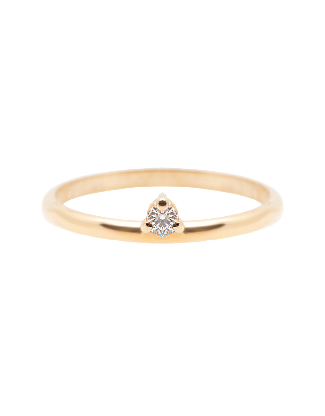 A dainty 14k yellow gold ring, set with one tiny, brilliant cut white diamond.